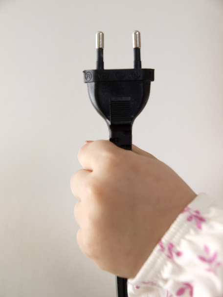 Plug in child hand - Photo, Image