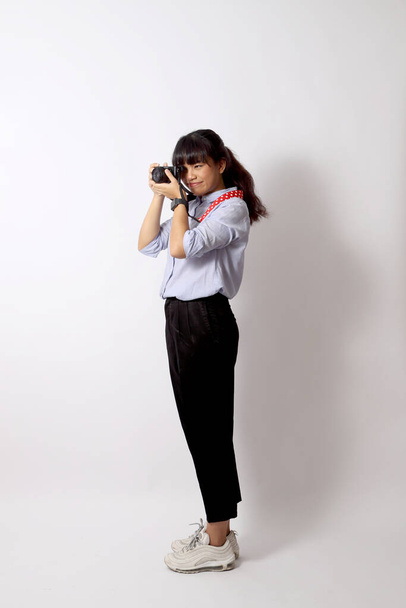 The Asian woman posing on the white background. - Valokuva, kuva