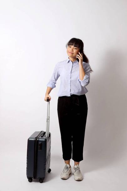 The Asian woman posing on the white background. - Foto, Bild