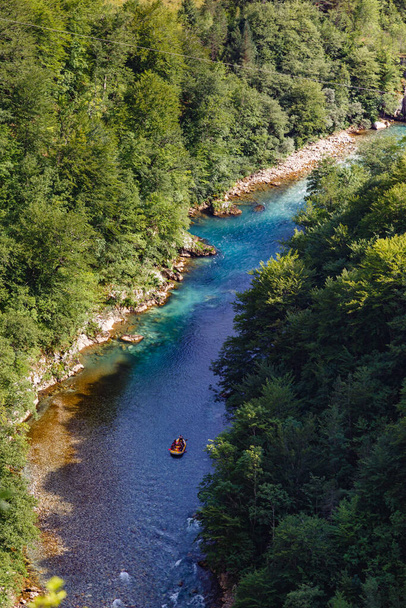 A vertical shot of a rafting boat in the Tara River in Montenegro - Photo, Image