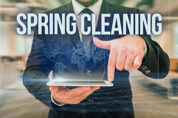 Sign displaying Spring Cleaning. Business overview thorough cleaning of a house or room during spring Man In Uniform Standing Holding Tablet Typing Futuristic Technologies. - Photo, Image