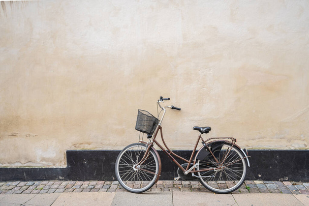 A closeup shot of a bicycle in a street - Fotó, kép