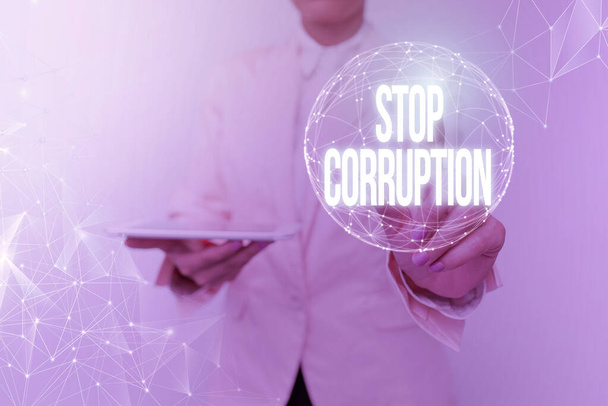 Conceptual display Stop Corruption. Business idea Put an end in abusing of entrusted power for private gain Woman In Suit Holding Tablet With Circular Holographic Display. - Photo, Image