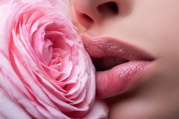 Lips with lipstick closeup. Girl open mouths. Natural beauty lips. Beautiful woman lips with rose. - Foto, imagen