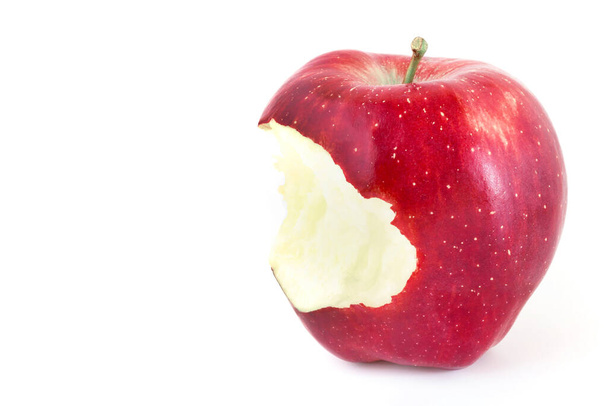 Red bitten apple on white background. Copy-space. - Photo, Image