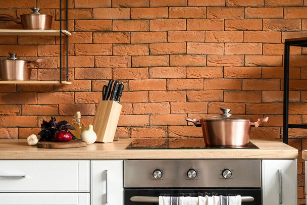Copper cooking pot on stove in kitchen - Photo, Image