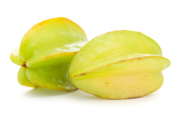 Detailed closeup of organic green fresh fruit carambola (Averrhoa carambola), isolated over white background - Photo, Image
