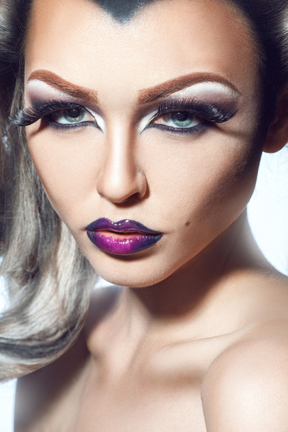 Serious young woman with healthy skin and professional make up - Foto, afbeelding