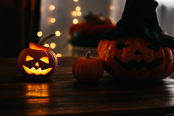 themed scary Halloween pumpkins standing on the table. halloween concept. - Fotoğraf, Görsel