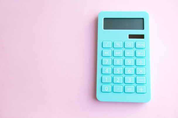 Mint calculator isolated on pink background with copy space. Concept of family budget, investments - 写真・画像