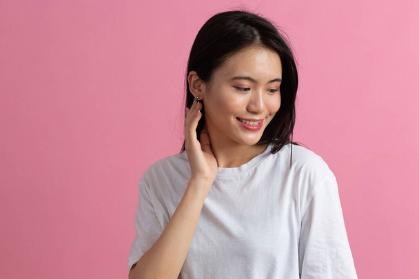 Portrait of asian woman on pink background - Photo, Image