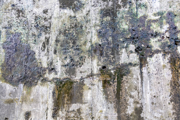 Υφή επιφάνεια του γκρίζου τσιμεντένιου τοίχου με γρατσουνιές και ρωγμές - Φωτογραφία, εικόνα