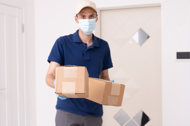 handsome young delivery man portrait on white - Photo, Image