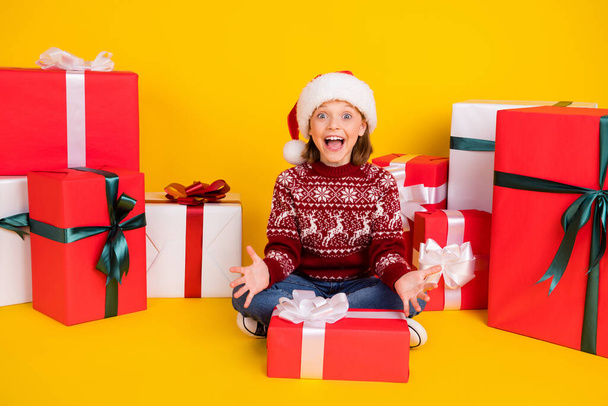 Full size photo of young girl happy smile amazed excited present box noel isolated over yellow color background - 写真・画像