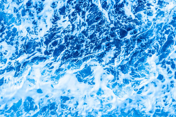 Aerial Ocean water blue surface with foam and waves. - Photo, Image