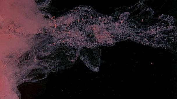 Beautiful wallpaper for your desktop. Pink cloud of ink on a black background. Drops of pink ink in water. Pink watercolor paints in water on a black background. Awesome abstract background. - Фото, зображення
