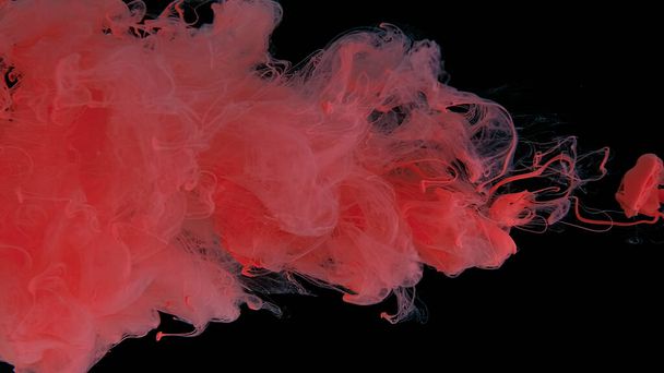 Pink cloud of ink on a black background. Drops of pink ink in water. Pink watercolor paints in water on a black background. Awesome abstract background. Beautiful wallpaper for your desktop. - Foto, afbeelding