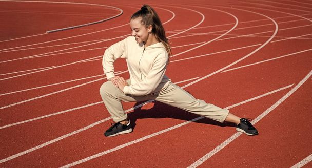 girl kid training sport outside on stadium arena, fitness - Valokuva, kuva