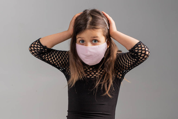 Young girl wearing masks to prevent disease, Caucasian female thinking about the problem - Foto, Bild