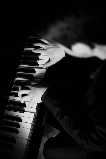 Piano player hands pianist playing music on keyboard. Musical instrument keys - Фото, зображення