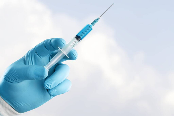 covid-19 coronavirus vaccination concept with medical syringe - Photo, Image