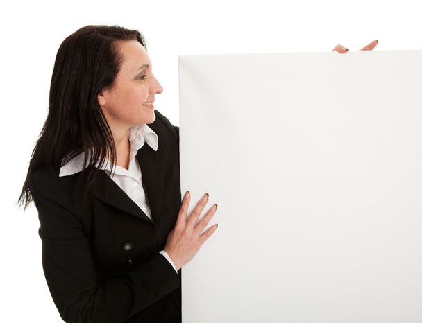 Cheerful businesswomen presenting empty board - Foto, immagini