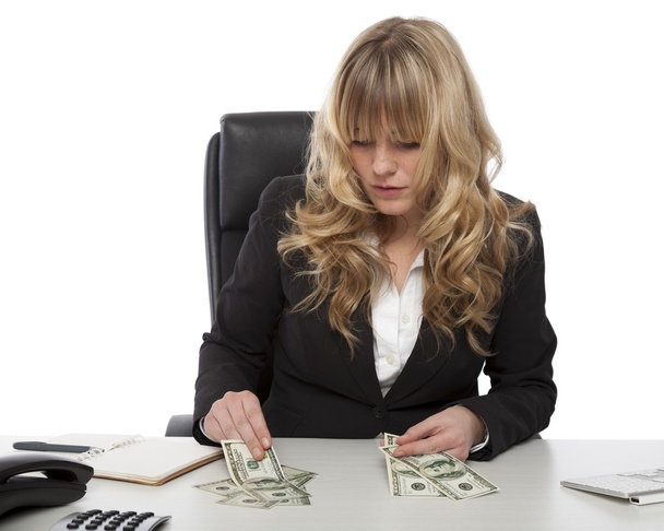 Businesswoman working out her finances - Fotó, kép