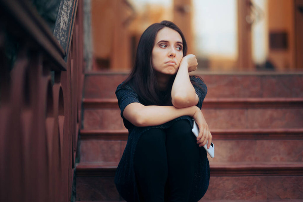 Sad Woman Attending a Party Sitting Alone on the Stairs - Photo, image
