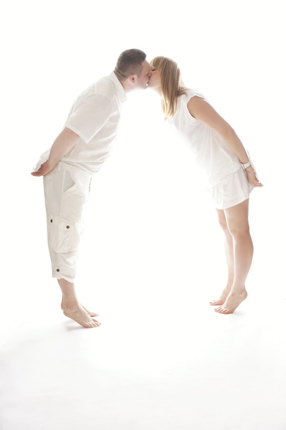 Lovely Couple Kissing While in Tiptoe - Foto, afbeelding