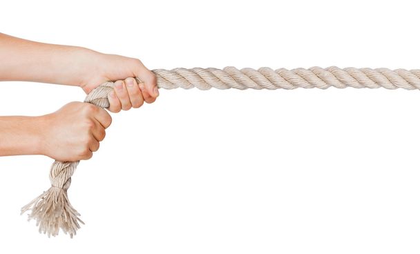 Hands pull a rope. Isolated white background - Foto, afbeelding