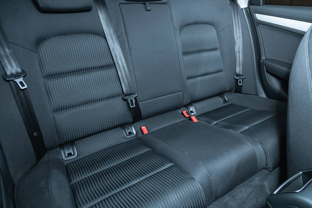 Novosibirsk, Russia - September  12, 2021: Audi A4, Rear seat for passengers in black textile. Comfort car inside - Foto, Bild