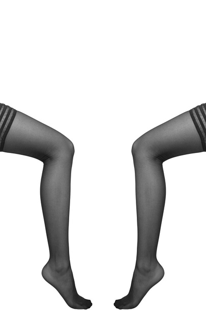 Hermosas piernas en medias agradables sobre fondo blanco
 - Foto, Imagen