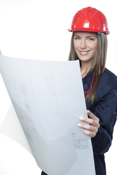 Female architect holding a blueprint - Фото, зображення