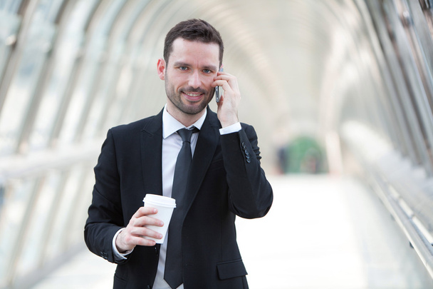 Businessman having a call during a break - Foto, afbeelding