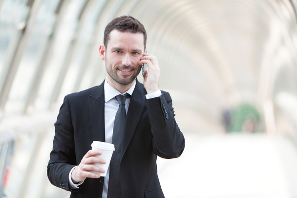 Businessman having a call during a break - 写真・画像