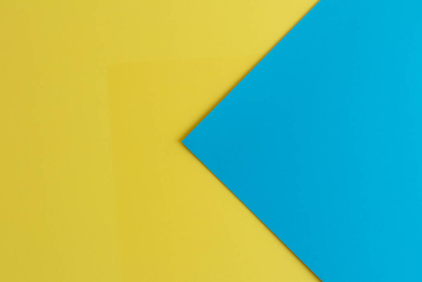 Een close-up van een geel en blauw oppervlak met ruimte voor tekst - Foto, afbeelding