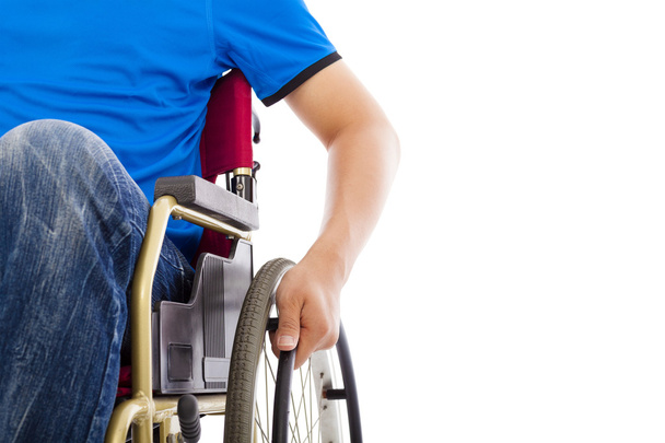 closeup of handicapped man sitting on a wheelchair - Фото, изображение