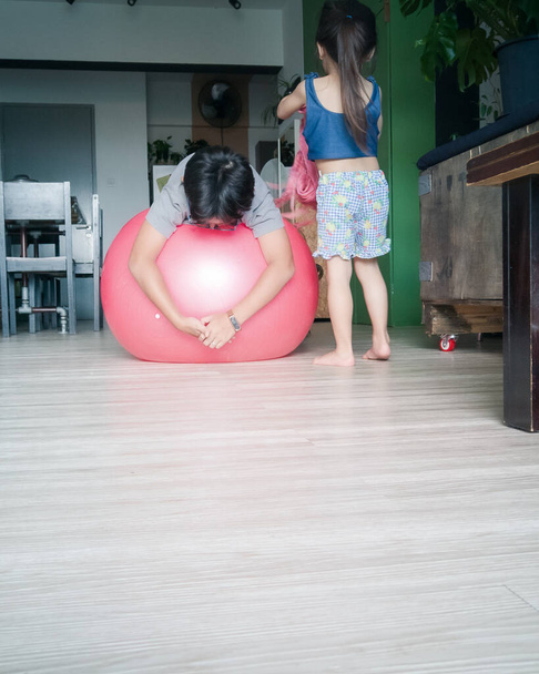 Children playing with gym ball at home. - Photo, Image