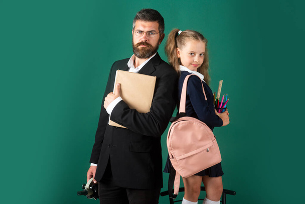 Back to school, student girl with uniform. Father or teacher and little child school girl in first grade. - Foto, Imagem