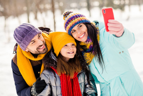 Photo of cheerful family happy positive smile shooting selfie smartphone travel weekend time together outdoors - 写真・画像