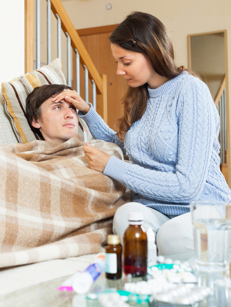 Woman caring for sick man - Photo, Image