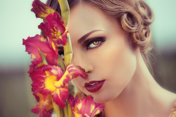 Beautiful woman in a flower field - Foto, immagini
