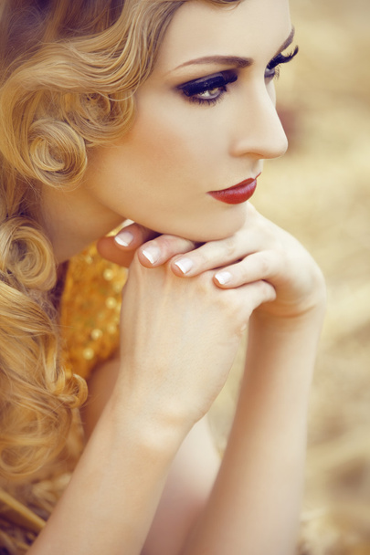 Beautiful woman in gold - Photo, image
