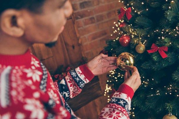 Blurred photo portrait guy preparing for xmas holidays decorating house xmas tree hanging baubles - Φωτογραφία, εικόνα