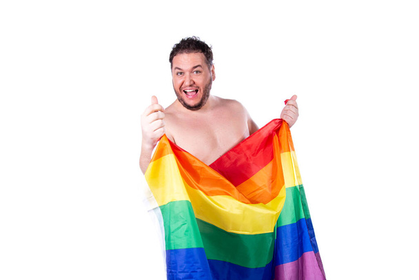 Funny fat man. Gay man and rainbow flag. - 写真・画像