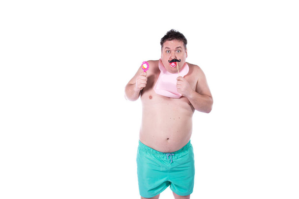 Funny fat man on a white background. - Foto, afbeelding