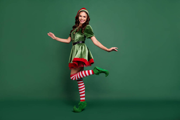 Full length body size view of attractive cheerful girl elf dancing amusement isolated over green color background - Фото, зображення