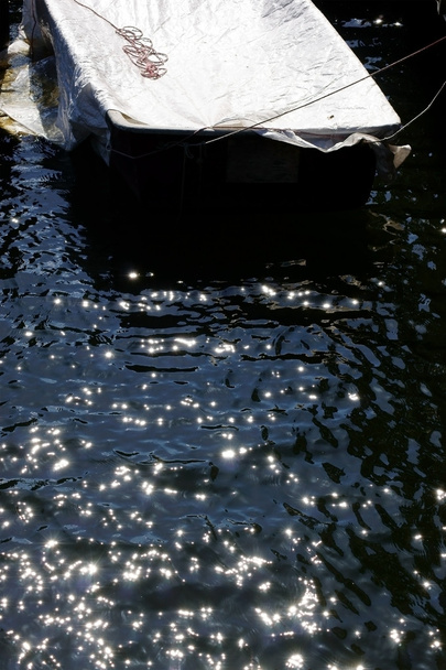 Rowing boat in the sparkling water - Photo, Image