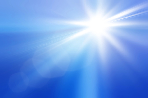 Soleil sur un ciel bleu avec rayons et fusée éclairante
 - Photo, image