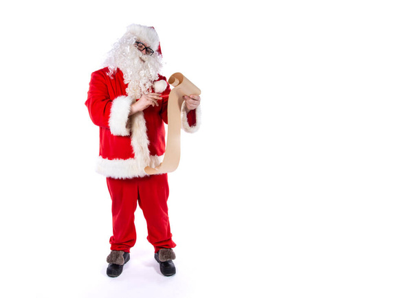 Legrační Santa Claus se seznamem dárků. - Fotografie, Obrázek
